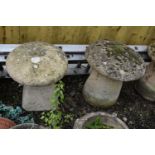 A PAIR MODERN COMPOSITE STADDLE STONES, one with tapered square base, the other circular base,