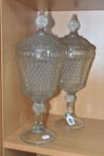 TWO LATE 20TH CENTURY AMERICAN 'INDIANA GLASS' CLEAR PRESSED GLASS JARS AND COVERS OF CHALICE