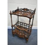 A VICTORIAN ROSEWOOD SERPENTINE CANTERBURY, the raised shelf with open fretwork gallery, on barley