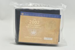 A ROYAL MINT 2002 GOLD PROOF SOVEREIGN COIN, shield design one year by Timothy Noad in unopened