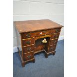 A REPRODUCTION GEORGIAN STYLE BURR WALNUT AND CROSSBANDED KNEE HOLE DESK, with seven drawers, on