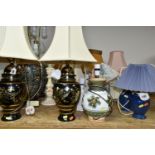 A LARGE QUANTITY OF TABLE LAMPS, comprising twenty one lamps, mostly ceramic bedside lamps, two