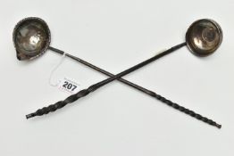 TWO GEORGE III WHITE METAL PUNCH LADLES ON WHALE BONE HANDLES, one inset with a George III 1787