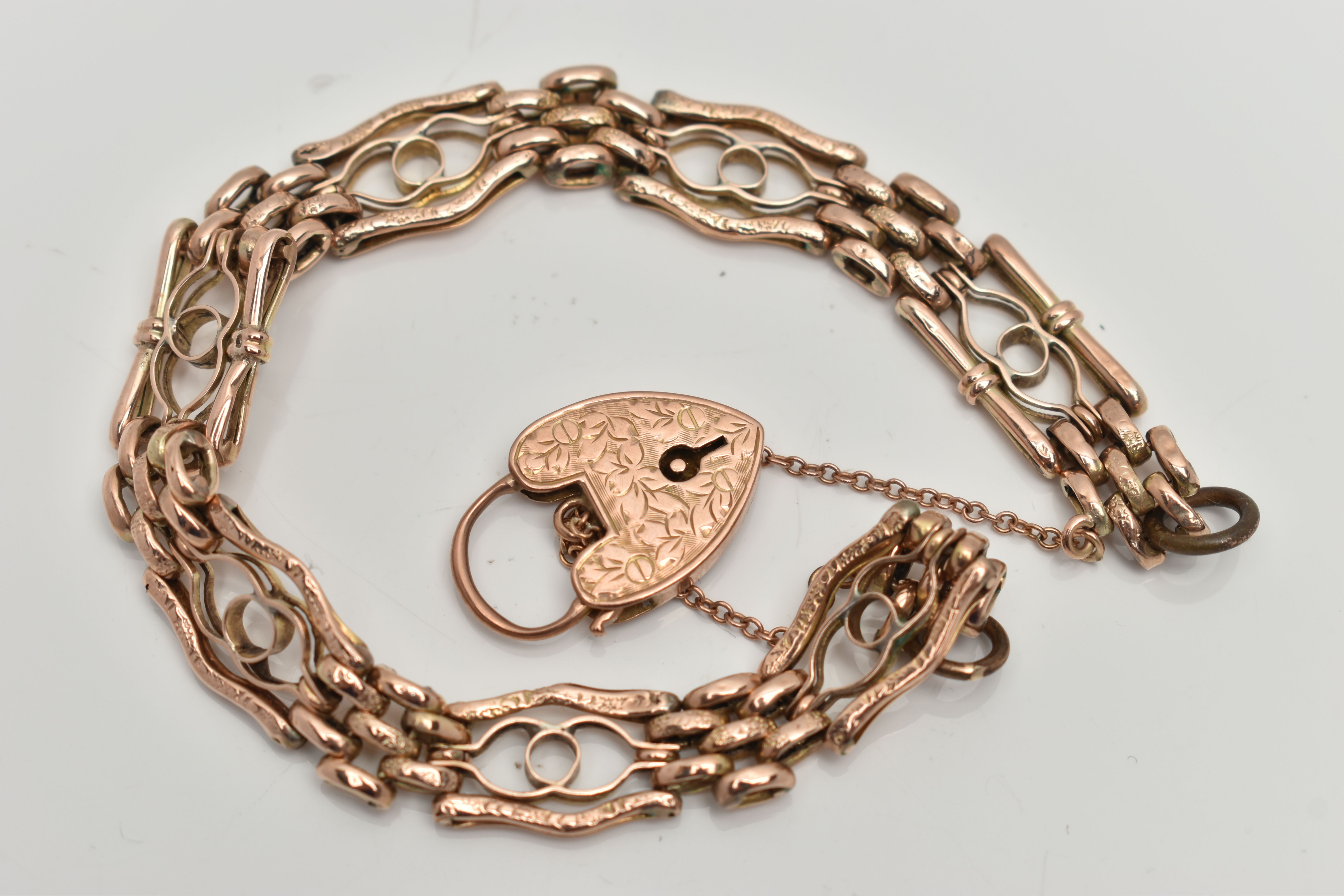 A YELLOW METAL FANCY GATE BRACELET, designed with a series of openwork links interspaced with oval - Image 2 of 3