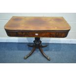 A REGENCY MAHOGANY TEA TABLE, with a fold over top, turned support and four scrolled legs, with