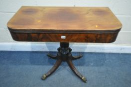 A REGENCY MAHOGANY TEA TABLE, with a fold over top, turned support and four scrolled legs, with