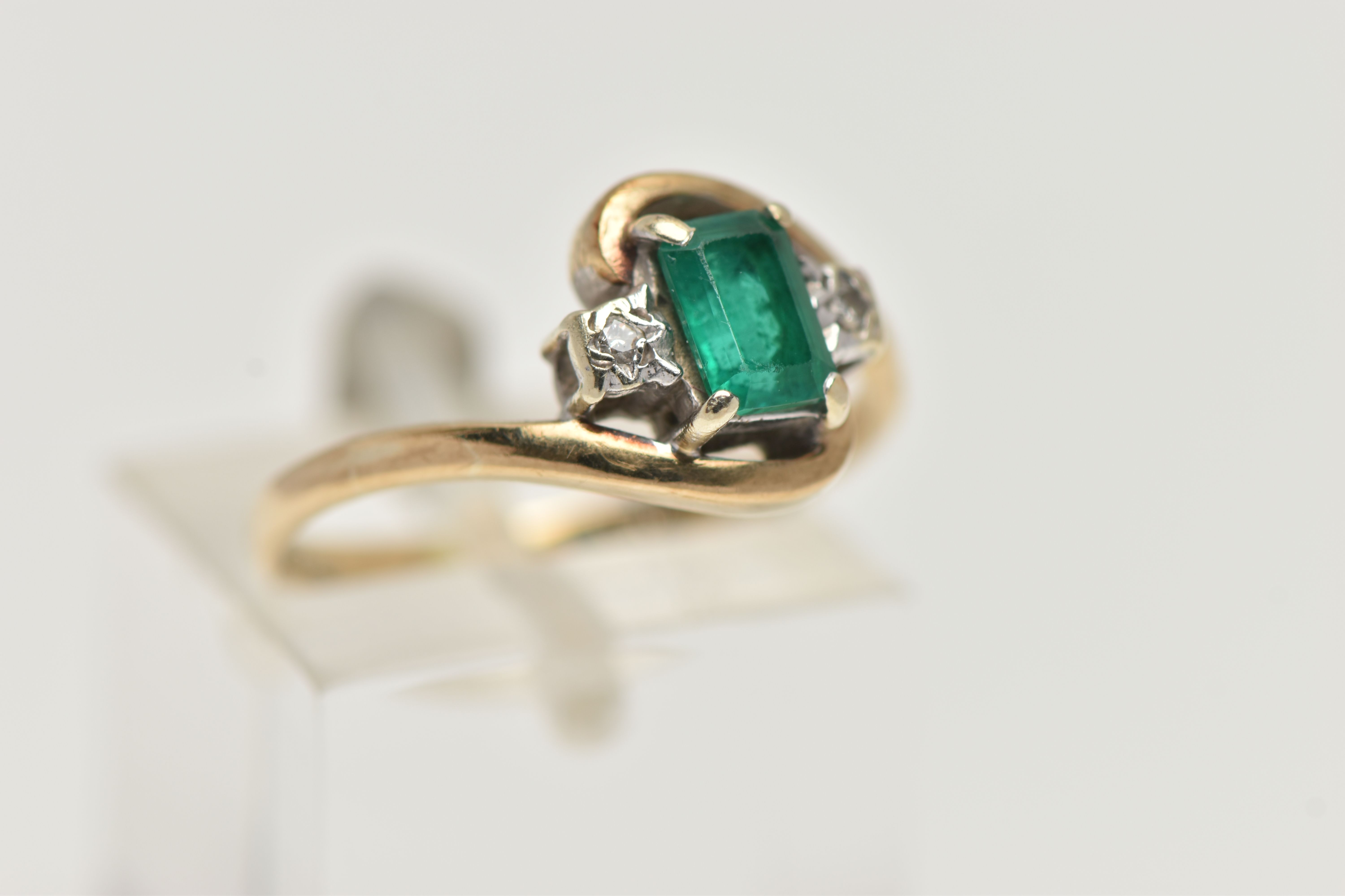 A 9CT GOLD EMERALD AND DIAMOND RING, designed with a rectangular cut emerald in a four claw setting, - Image 4 of 4