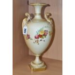 A ROYAL WORCESTER BLUSH IVORY PEDESTAL VASE, raised on a square plinth, having two scrolling foliate