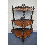 A VICTORIAN ROSEWOOD THREE TIER WHATNOT, with an open fretwork raised back, joined by barley twist
