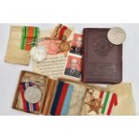 A SELECTION OF WORLD WAR TWO MEDALS AND A MONEY BOX, to include the Africa Star, the 1939-45 War