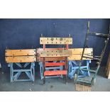A COLLECTION OF FOUR FOLDING WORKBENCHES, along with a folding trolley, and three rollators (8)