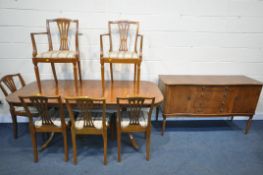 A YEWWOOD DINING SUITE, comprising an extendable pedestal dining table, with one additional leaf,