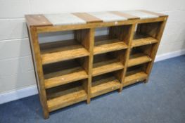 AN INDONESIAN HARDWOOD SIDE UNIT, with nine shelves, width 171cm x depth 45cm x height 113cm