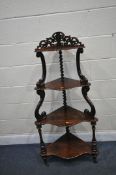 A VICTORIAN ROSEWOOD GRADUATED FOUR TIER WHATNOT, with an open fretwork gallery, joined by