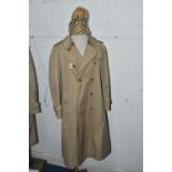 A LADIES' BURBERRY TRENCH COAT, approximate size UK 14/16, together with a cotton Burberry bucket