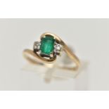 A 9CT GOLD EMERALD AND DIAMOND RING, designed with a rectangular cut emerald in a four claw setting,