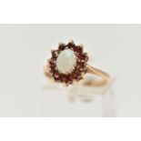 A 9CT GOLD OPAL AND GARNET CLUSTER RING, of an oval form, set with an oval cut opal cabochon claw