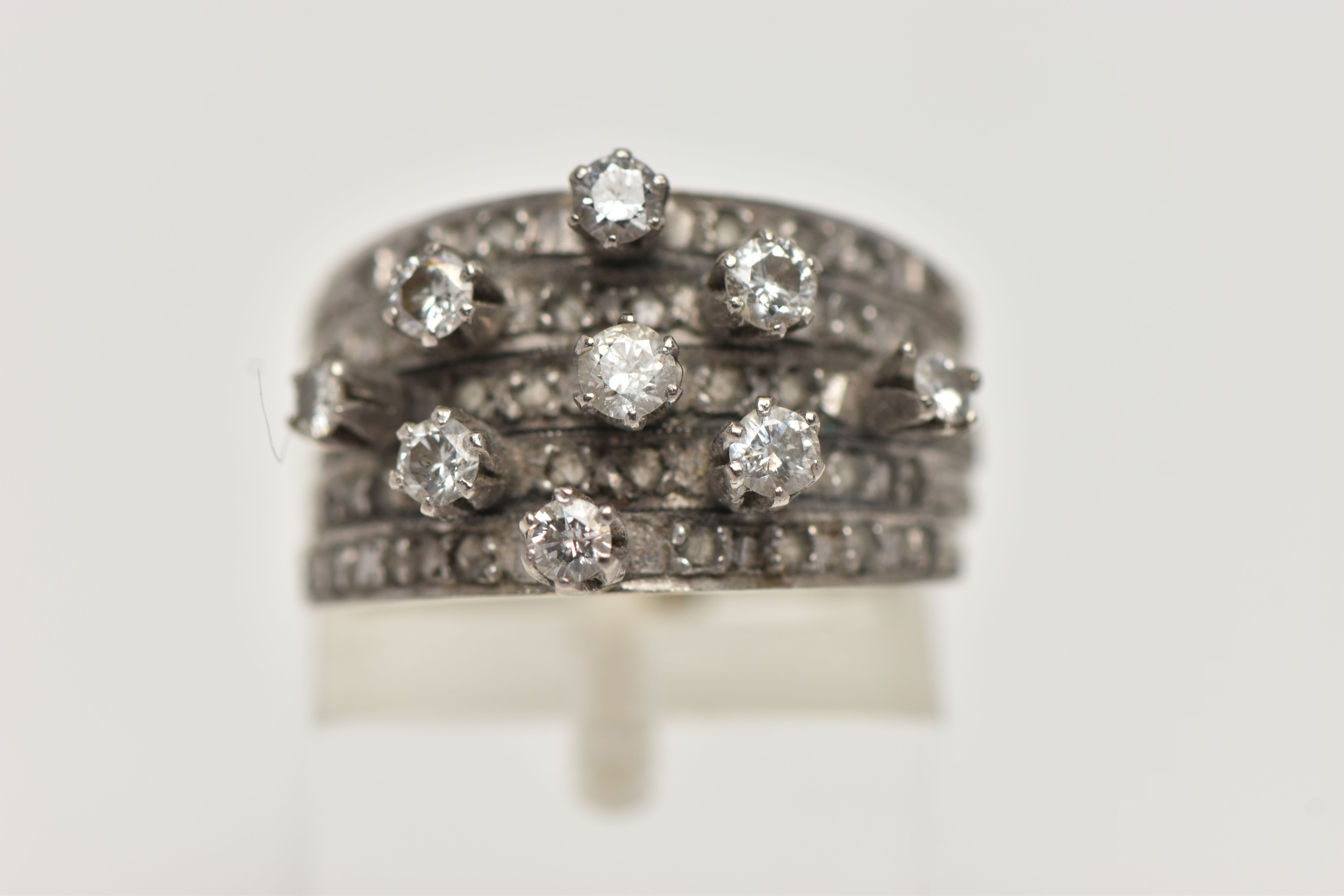 A WHITE METAL DIAMOND RING, comprising of five individual bands fitted together with a band - Image 5 of 5