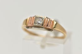 A YELLOW METAL SINGLE STONE DIAMOND RING, set with a round brilliant cut diamond, estimated