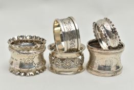 FIVE 20TH CENTURY SILVER CIRCULAR NAPKIN RINGS, two with crimped rims, three engraved with initials,