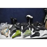 A SELECTION OF VARIOUS BICYCLE SADDLES to include new and used bicycle seats/saddles (2)
