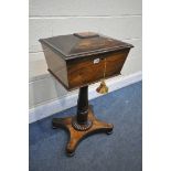 A VICTORIAN ROSEWOOD TEAPOY, the lid is enclosing a fitted interior, on a cylindrical support, and