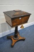 A VICTORIAN ROSEWOOD TEAPOY, the lid is enclosing a fitted interior, on a cylindrical support, and