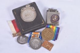 A WWI BLACK WATCH PAIR OF MEDALS, SILVER WAR BADGE AND A BOXED SCHOOL ATTENDANCE MEDAL, the medals
