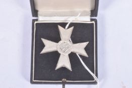A GERMAN THIRD REICH FIRST CLASS WAR MERIT CROSS WITHOUT SWORDS, this merit cross is silver in