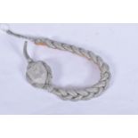 A GERMAN NAZI THIRD REICH SHOOTING LANYARD, this has interwoven silver thread and features a metal