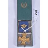 A GERMAN WWII ERA TWENTY FIVE YEAR LONG SERVICE POLICE MEDAL, the medal is gold in colour and has