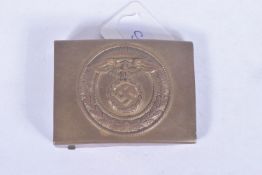 A GERMAN BELT BUCKLE, this one is all made from brass and features an eagle and Swastika in the