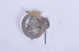 A GERMAN KRIEGSMARINE HIGH SEAS FLEET BADGE TOGETHER WITH A STICK PIN, the badge itself has lost