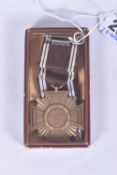 A THIRD REICH NSDAP TEN YEAR LONG SERVICE MEDAL IN BOX OF ISSUE, this medal is bronze and still