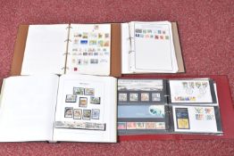 COLLECTION OF STAMPS IN FOUR ALBUMS, we note GB presentation packs and a GB QE2 mint and used