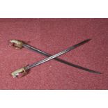 TWO VICTORIAN NAVAL DRESS SWORDS, the first has an ornamental straight blade with a six pointed star