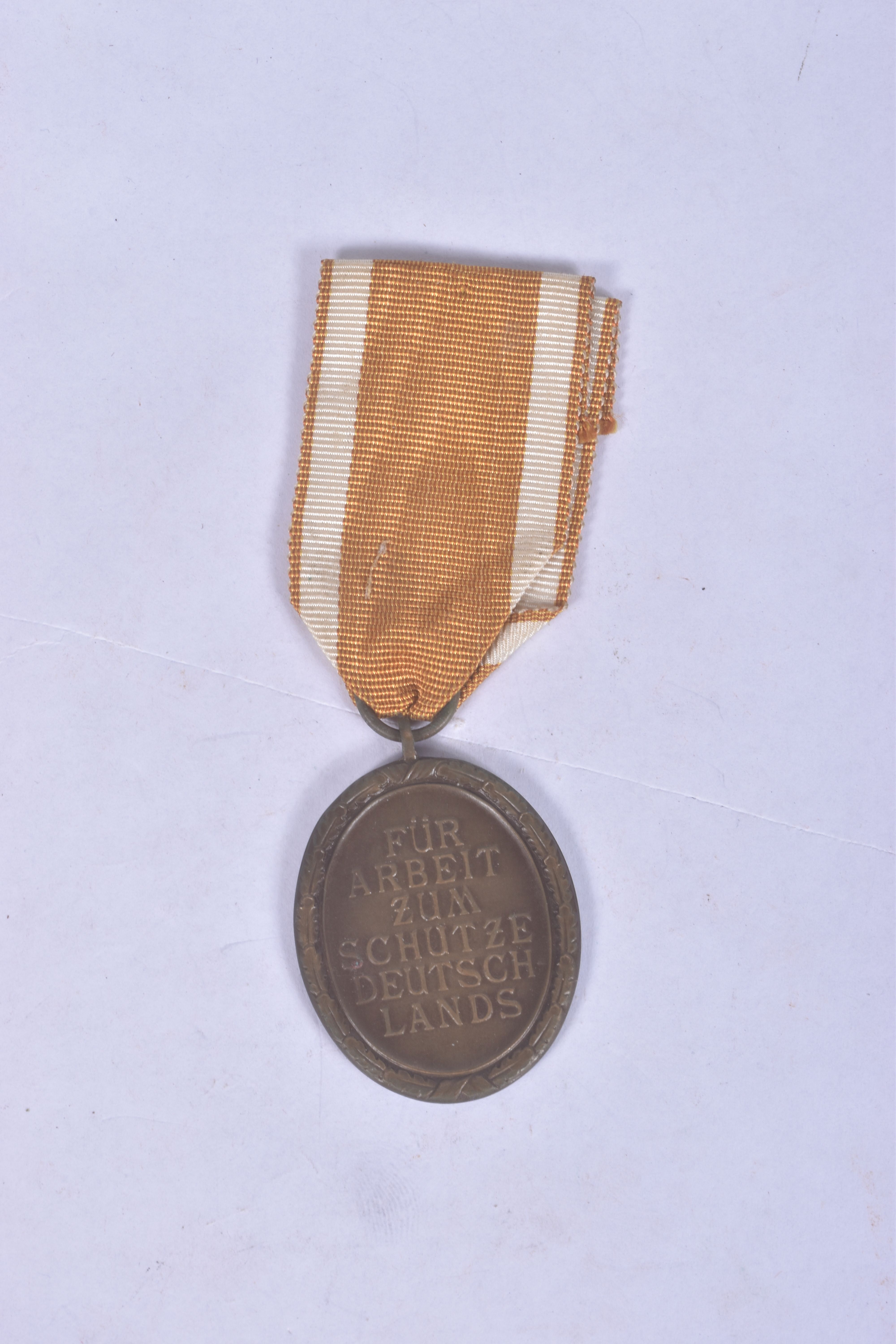 A WW1 HAMBURG CROSS AND A WW2 WEST WALL MEDAL, BOTH MEDALS COME WITH a correct ribbon and are in - Image 5 of 5