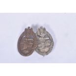 TWO GERMAN THIRD REICH PANZER ASSAULT BADGES, one is bronze in colour with a rounded pin and has