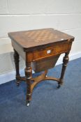A LATE VICTORIAN BURR WALNUT WORK TABLE, with a games playing surface, swivel fold over top
