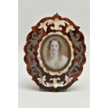 A VICTORIAN HEAD AND SHOULDERS IVORY PORTRAIT MINIATURE OF A YOUNG WOMAN, her brown hair in