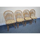 A SET OF FOUR BEECH HOOPED BACK DINING CHAIRS