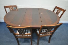 A MAHOGANY CIRCULAR PEDESTAL DINING TABLE, with a single fold out leaf, extended length 154cm x