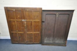 AN OPPOSING PAIR OF EARLY 20TH CENTURY STAINED PINE PANELLED SINGLE DOOR CUPBOARD, enclosing an