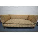 A 19TH CENTURY BOX FRAMED SOFA, in the manner of Howard and Sons, on shaped legs and later