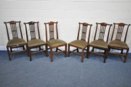 A SET OF SIX GEORGE II WALNUT CHAIRS, the wavy top rail with a carved circular over straight pierced