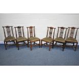 A SET OF SIX GEORGE II WALNUT CHAIRS, the wavy top rail with a carved circular over straight pierced