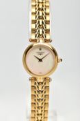 A 'LONGINES' WRISTWATCH, quartz movement, round mother of pearl dial signed 'Longines', yellow metal