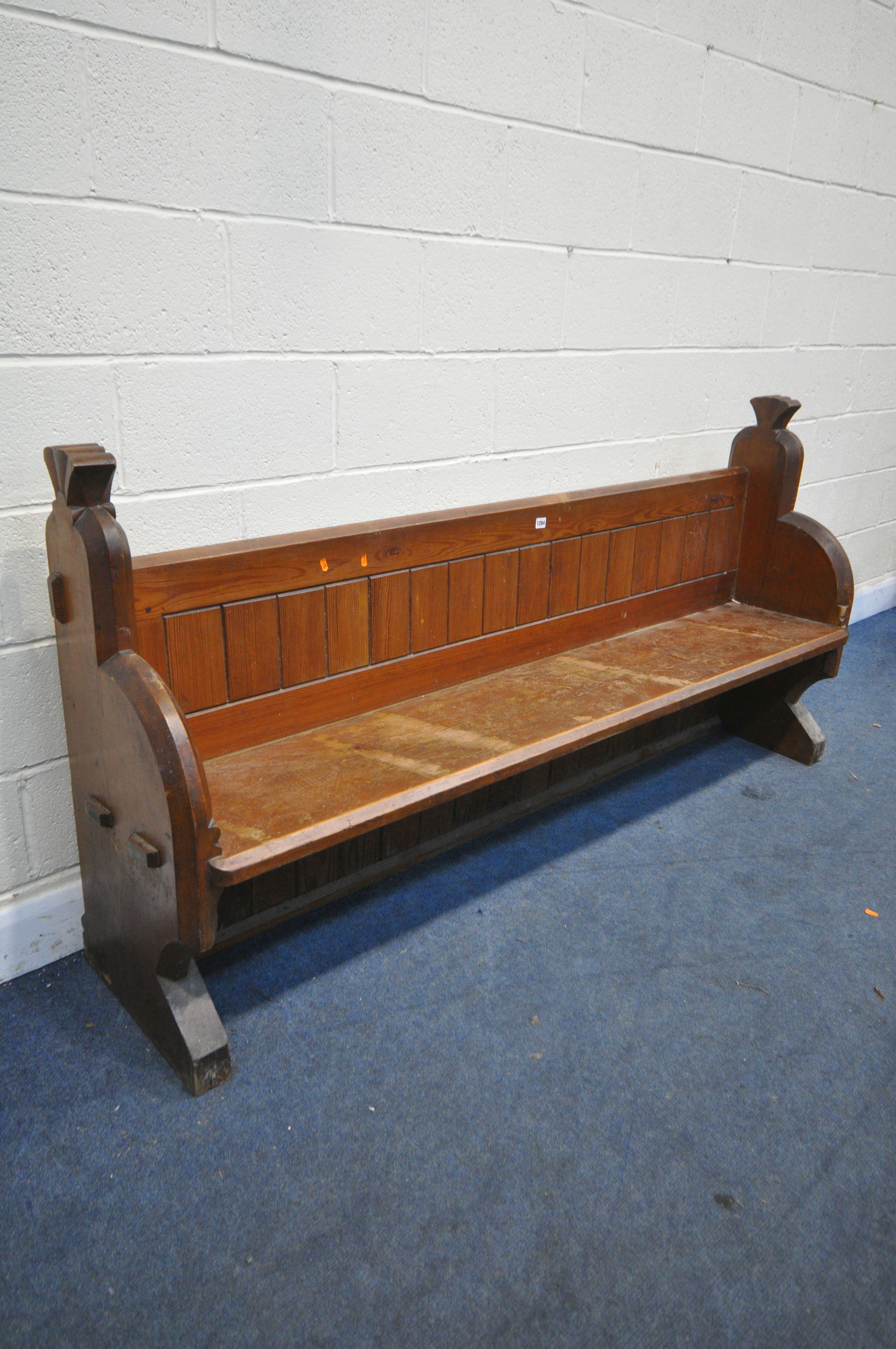 A PITCH PINE CHURCH PEW, length 197cm x depth 50cm x height 97cm (condition:-worn and water