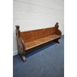 A PITCH PINE CHURCH PEW, length 197cm x depth 50cm x height 97cm (condition:-worn and water