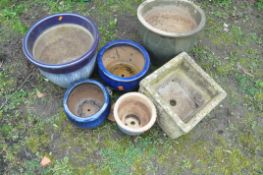 A SELECTION OF PLANT POTS to include five circular glazed pots all diferent sizes along with a